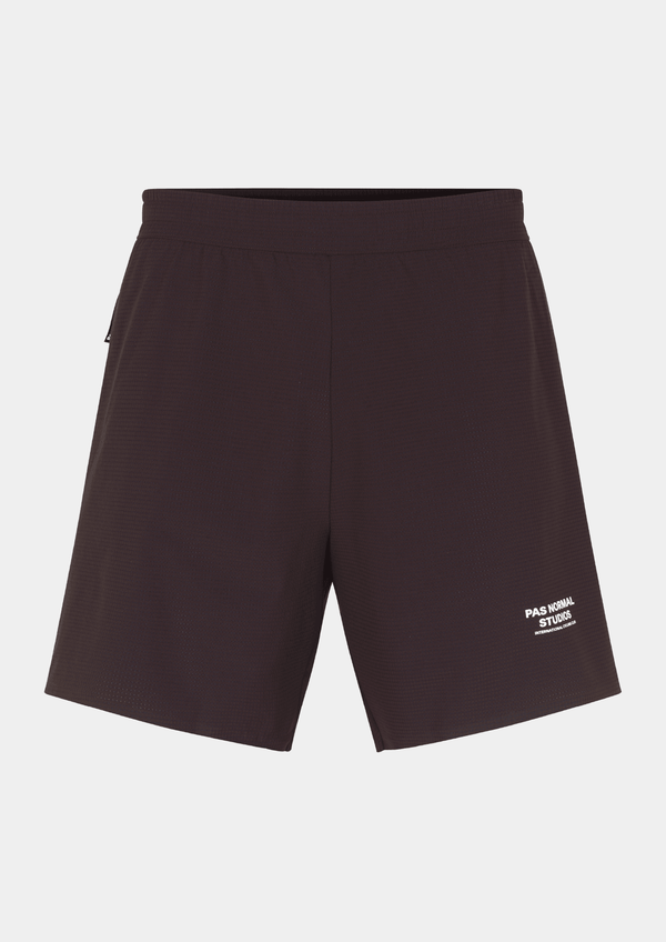 Front view of the Pas Normal Studios Men’s Balance Shorts  in the color dark red. Adjustable elastic waistband and tight fit with Pas Normal Studio font logo in white on lower left side. Not a tight fitting short.
