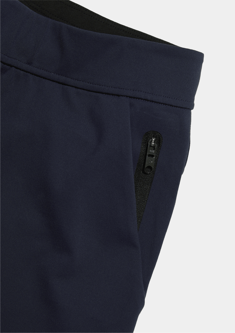 Mens Public Rec All Day Every Day Jogger pant with cuffed ankle in the color navy blue. Detail close up photo of the front zipper pockets.